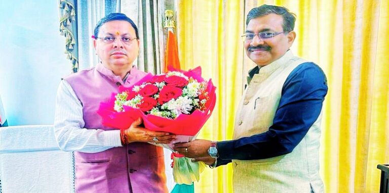CM Dhami & IAS officer Anand Bardhan